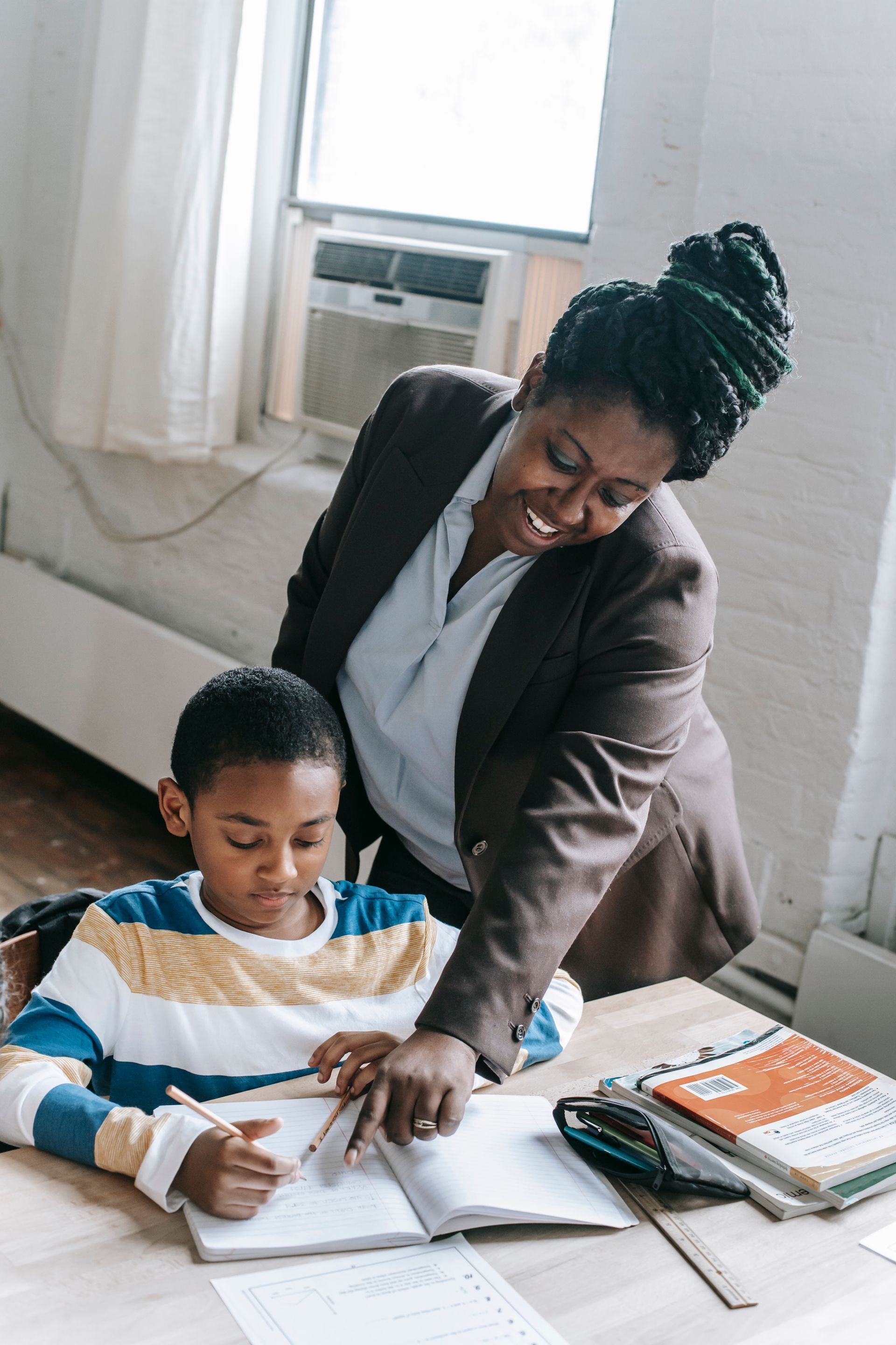 A teacher helping a pupil